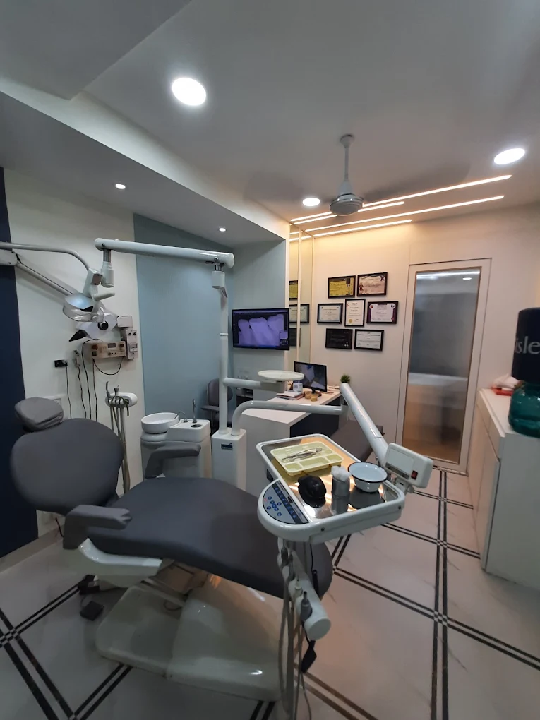 Smile Plus Dental Clinic treatment room with X-ray screen and certifications, Powai, Mumbai